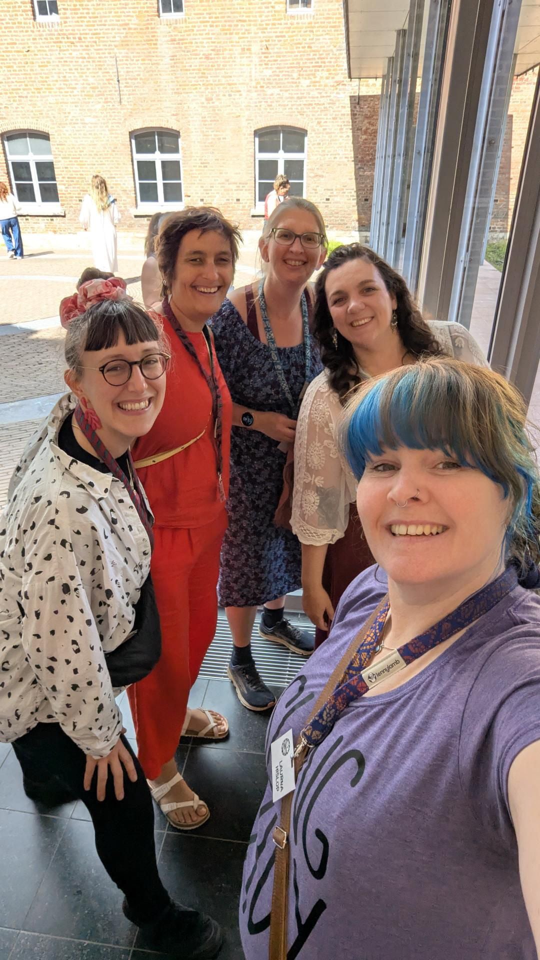 Find Baby carrier consultants nearby with the Hana Baby Interactive map. Pictured in this picture are a group of baby wearing experts taking a group selfie at the European Babywearing Conference.
