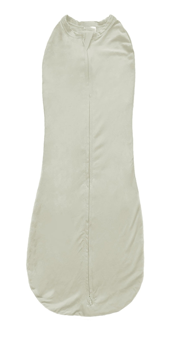 An off-white newborn sleeping bag and an off white background