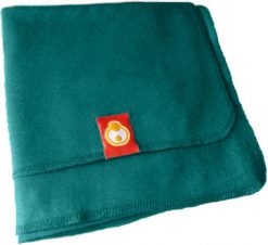 Green newborn blanket with a red tag featuring a yellow logo on a white background